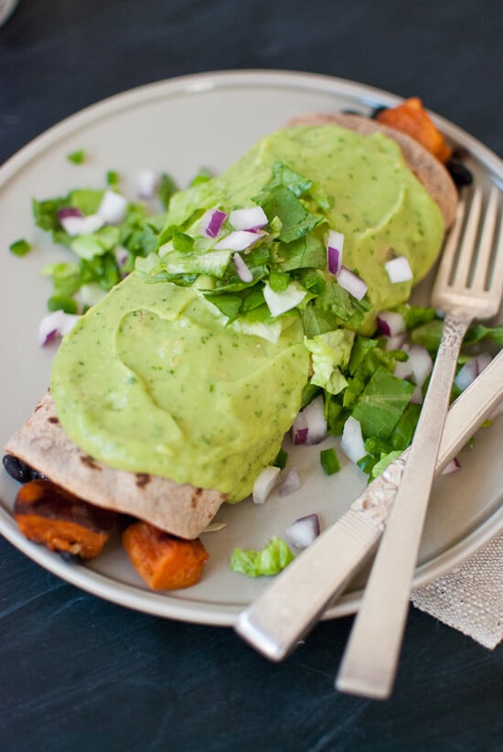 Sweet potato burrito smothered with avocado salsa verde from cookieandkate.com Sweet potato burrito smothered with avocado salsa verde
