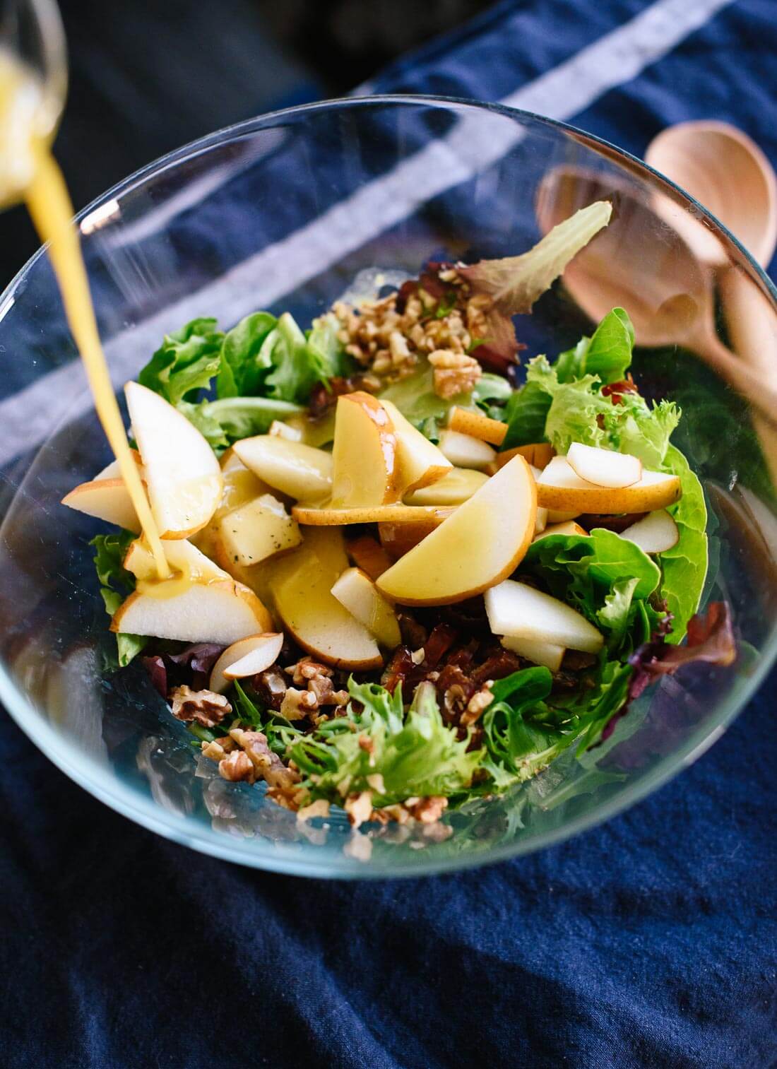 Here's a fresh green salad for your holiday table, featuring pears, walnuts, dates and blue cheese tossed in a simple vinaigrette! cookieandkate.com