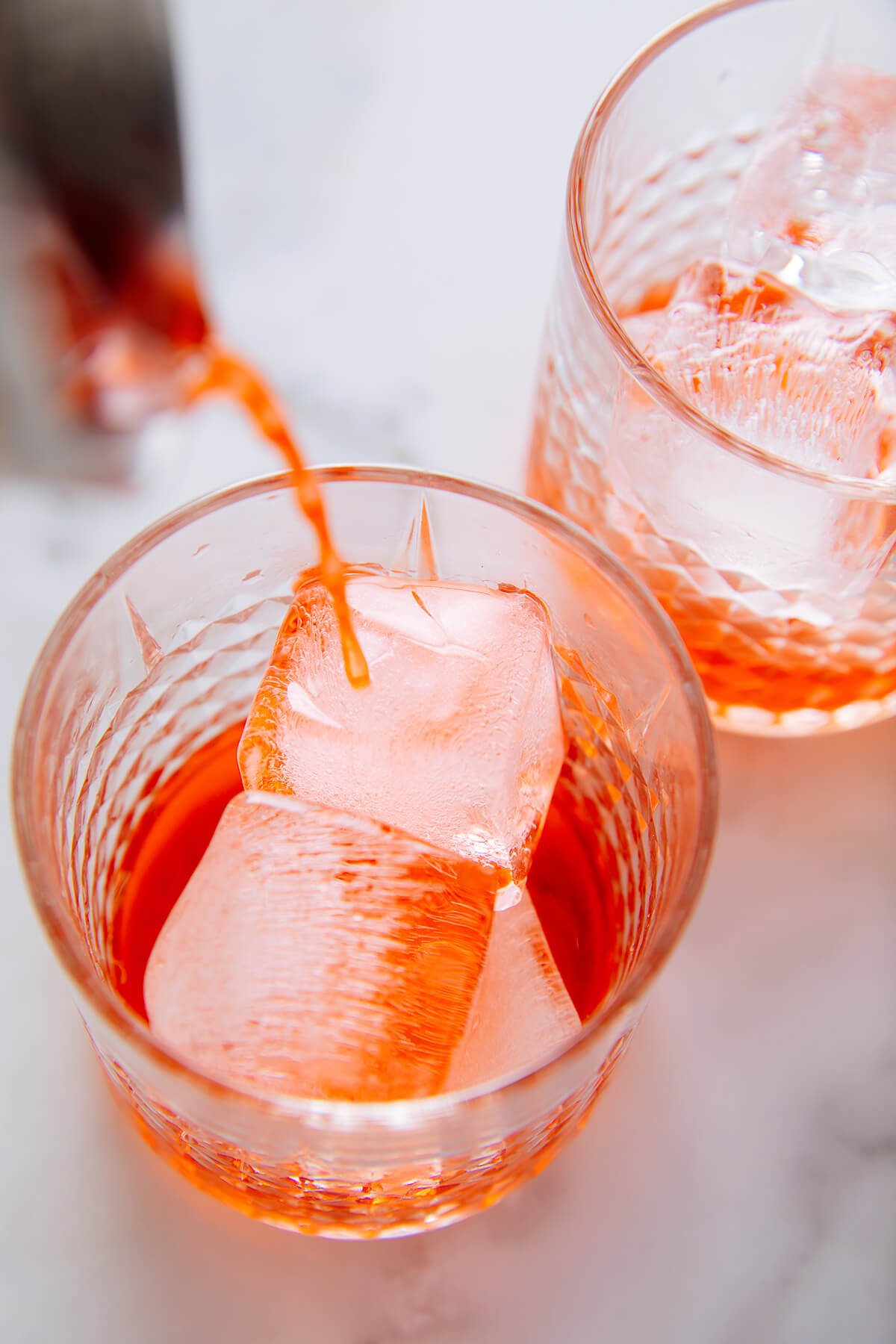 pouring Campari over ice